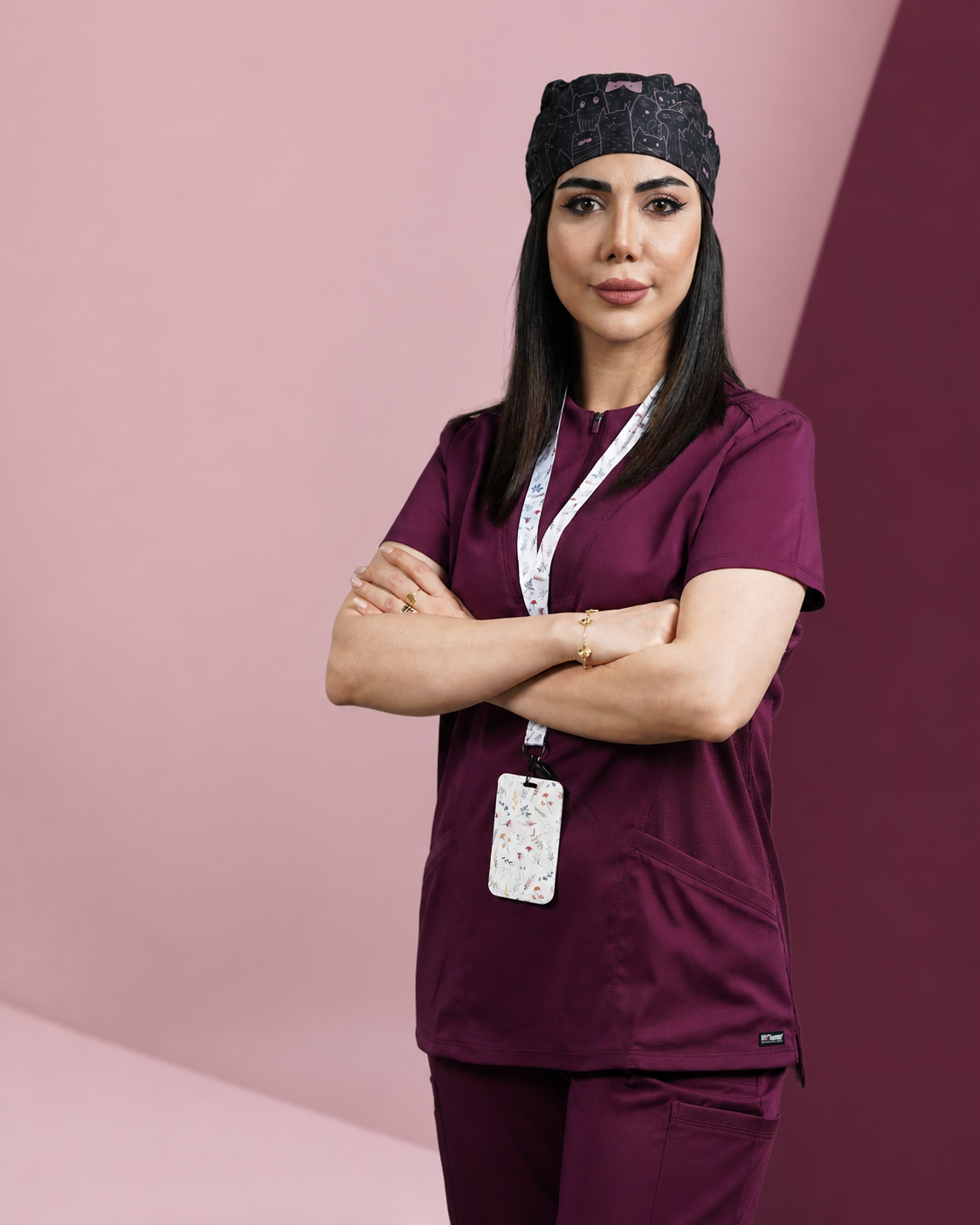 Woman wearing burgundy medical scrubs
