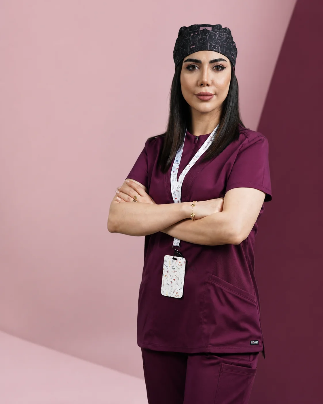 Woman wearing burgundy medical scrubs